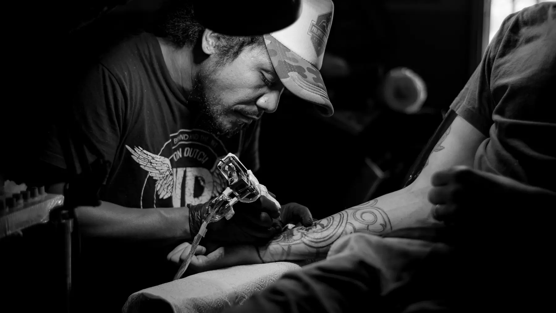 A tattoo artist at work in the Kafka INK studio